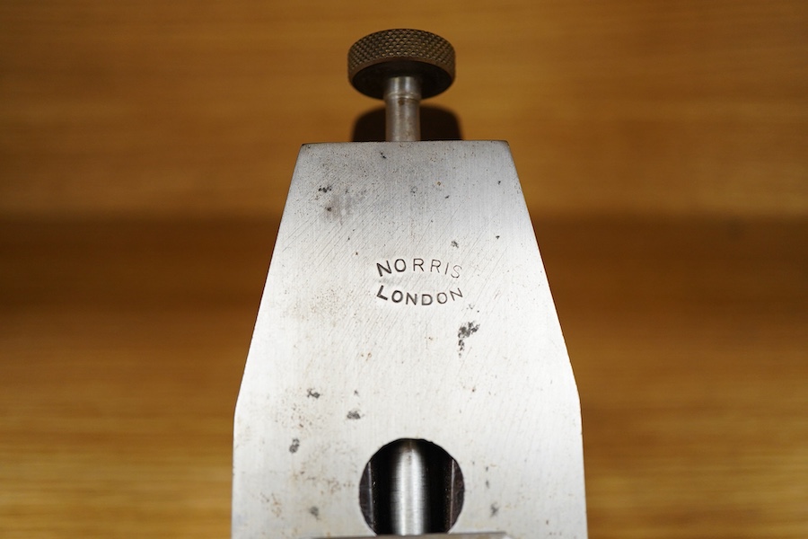 A Norris A1 adjustable steel 14 1/2” panel plane, stamped with Norris, London to both the brass lever cap and the iron, with rosewood infill